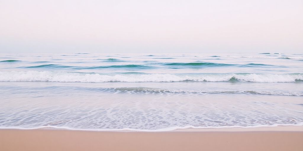 Serene landscape with gentle waves lapping a sandy shore.